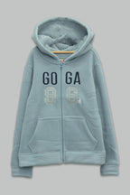 Sudadera sherpa niña bordada con manga larga, capucha ajustable, bolsas frontales y cierre