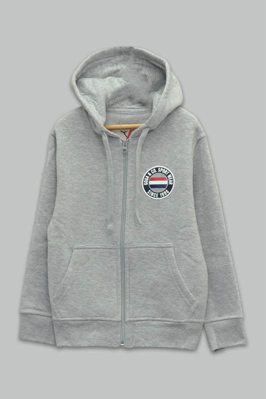 Sudadera felpa Niño bordada con manga larga, capucha ajustable, bolsas frontales y cierre.