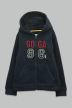 Sudadera sherpa niña bordada con manga larga, capucha ajustable, bolsas frontales y cierre