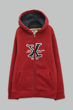 Sudadera polar para Niño bordada con manga larga, capucha ajustable, bolsas frontales y cierre.